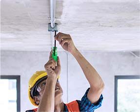 Stock image of a man doing electric work